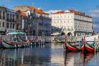 Gondola style fishing tour boats in canal in Aveiro, Portugal. Art Print